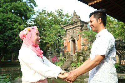 Young couple standing outdoors
