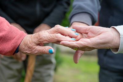 Midsection of man holding hands