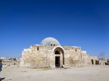 View of temple against clear blue sky