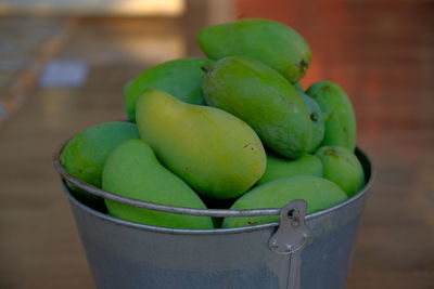 Close-up of green fruits on table at market