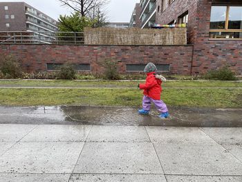 Kid running in rain