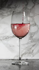 Close-up of wine in glass on table