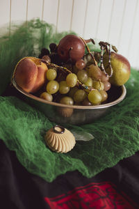 Close-up of fruits in bowl on table
