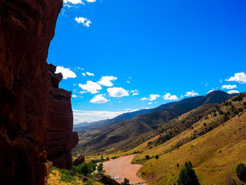 Scenic view of mountains against blue sky