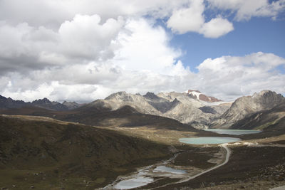 Scenic view of landscape and mountains against sky