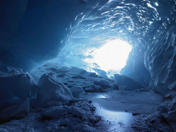 Light streaming into an ice cave in iceland