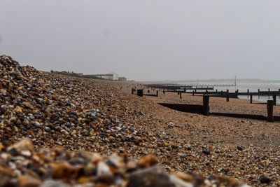 Scenic view of beach against clear sky