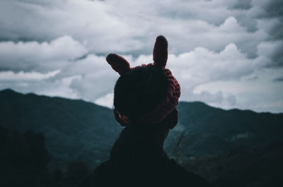 Man on mountain against sky