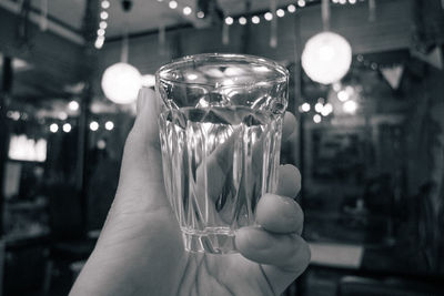 Close-up of hand holding wineglass