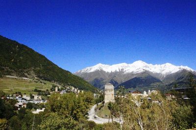 View of mountain range against blue sky