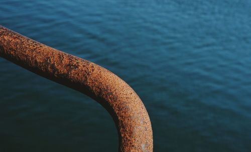 Close-up of rusty metal on river