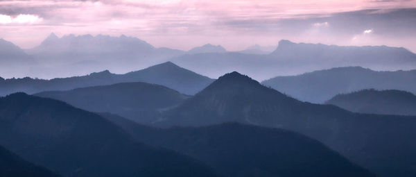 Scenic view of mountains against sky during sunset