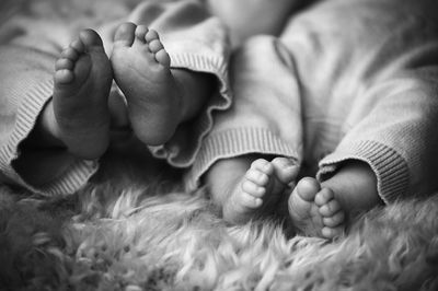 Twin babies toes and feet black and white