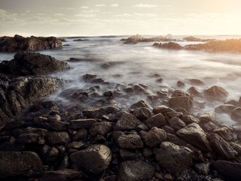 Scenic view of sea against sky during sunset