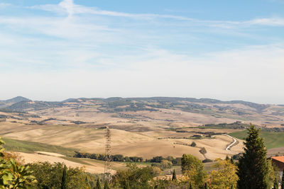 Scenic view of landscape and mountains against sky