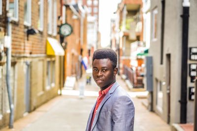 Portrait of happy man on urban street