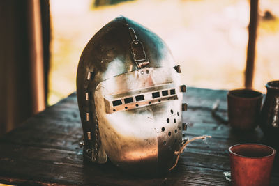 Close-up of mask on wooden table