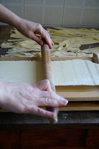 Midsection of person preparing food on table