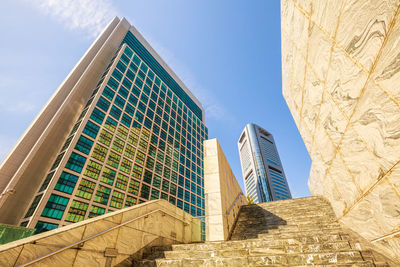 Low angle view of buildings against blue sky