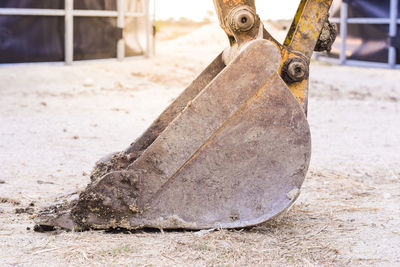 Close-up of old machine on field