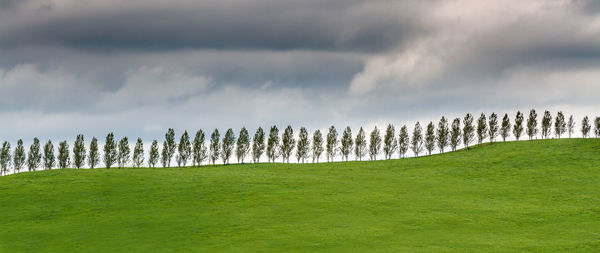 Panoramic view of landscape against cloudy sky