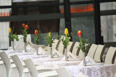 Flowers in glass vase on table