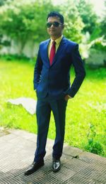 Full length of man wearing sunglasses standing outdoors