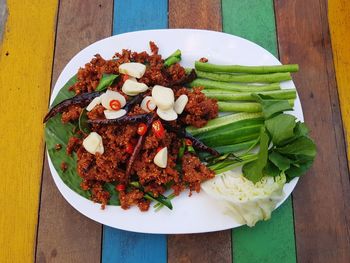 High angle view of chopped vegetables in plate on table