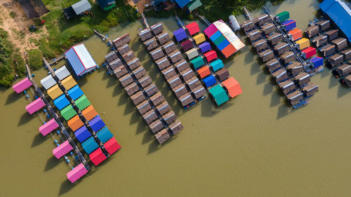 Aerial view of multi colored shack in lake