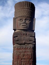 Low angle view of statue against sky