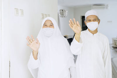 Portrait of friends standing in traditional clothing