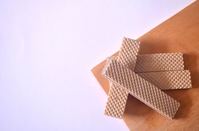 High angle view of paper flag on table against white background