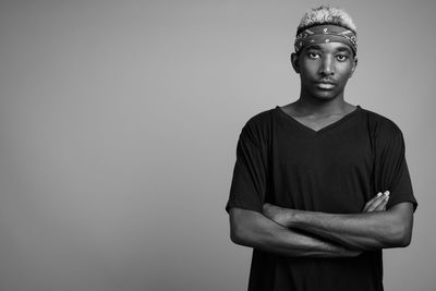 Portrait of young man against white background