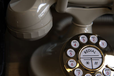 High angle view of retro style landline phone on table