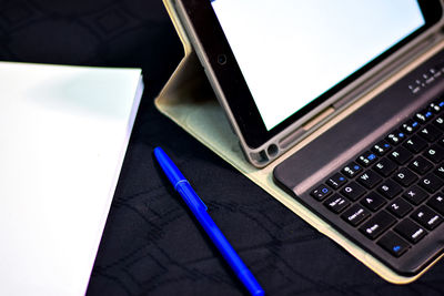 High angle view of mobile phone on table