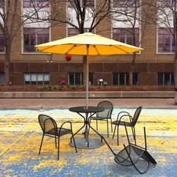 Empty bench in front of building