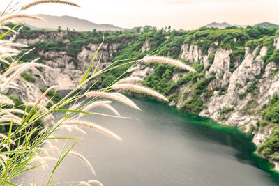 Scenic view of river amidst mountains