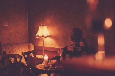 Women sitting at illuminated restaurant