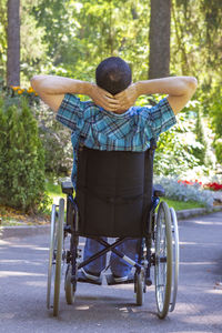 Man sitting on wheelchair at park