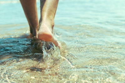 Low section of woman in water