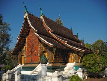 Low angle view of traditional building against clear blue sky