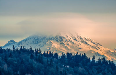 Clouds cover mount rainier across the puget soud in washington state.