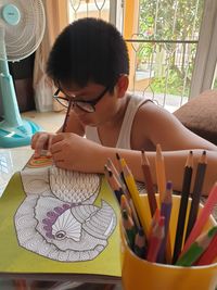 Woman sitting on table at home