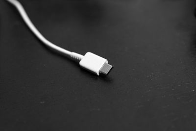 Close-up of usb cable on black background