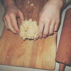 Cropped image of hand holding meat