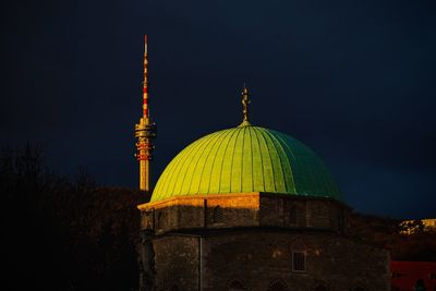 Illuminated cathedral against sky at night