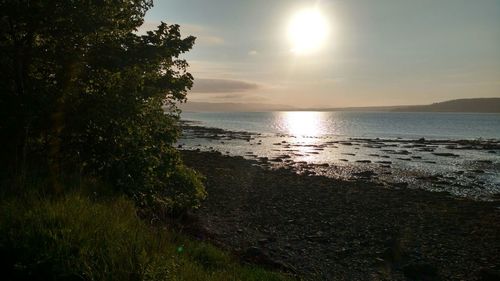 Scenic view of sea against sky at sunset