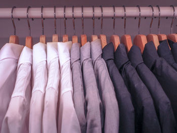 Close-up of clothes hanging on rack