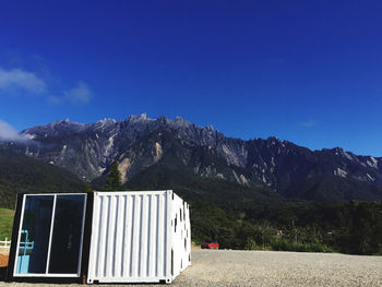 Scenic view of mountains against clear blue sky