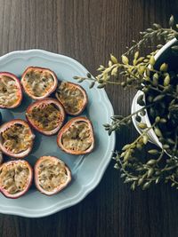 Directly above shot of passion fruits in plate on table